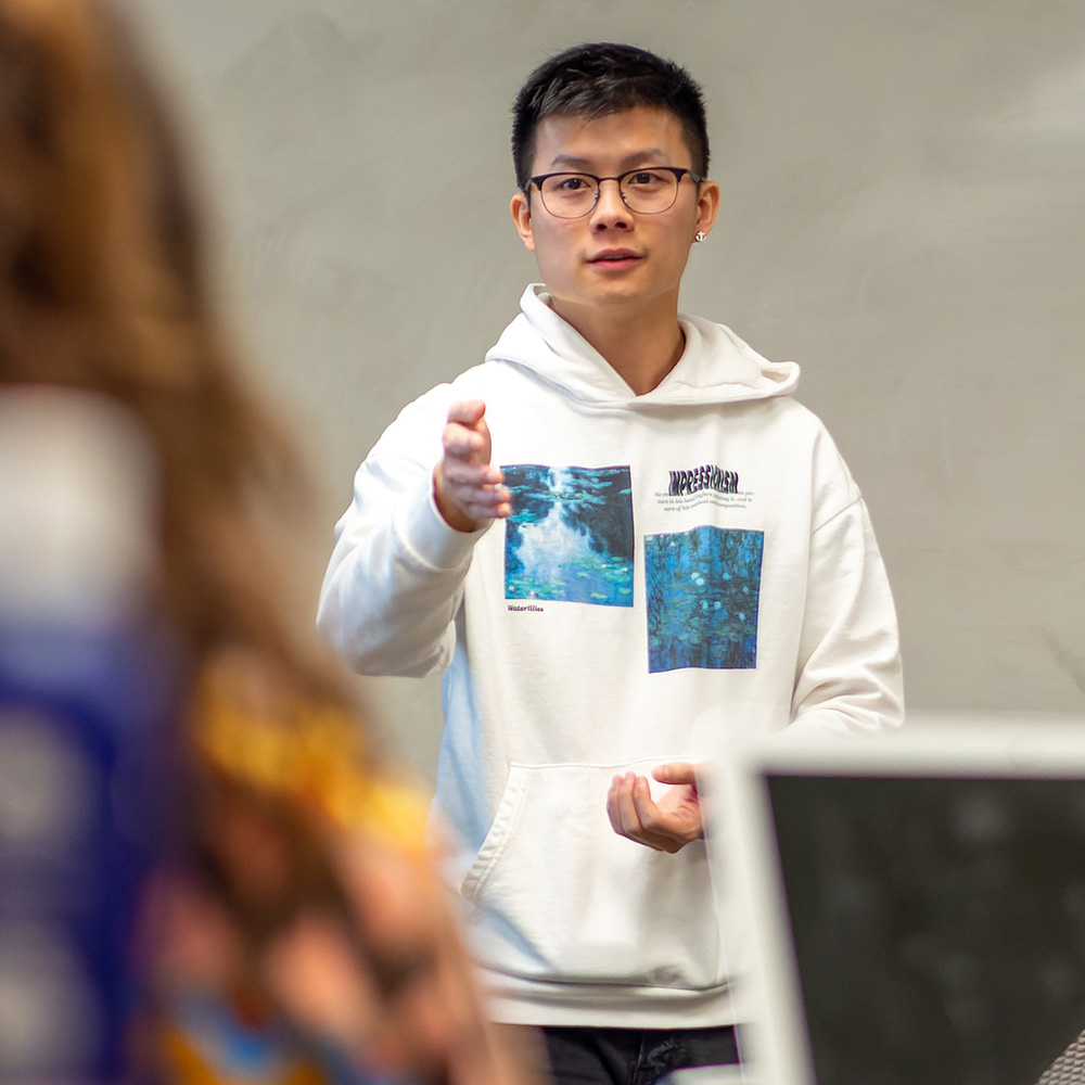 Hoky Hsu speaking to a class.